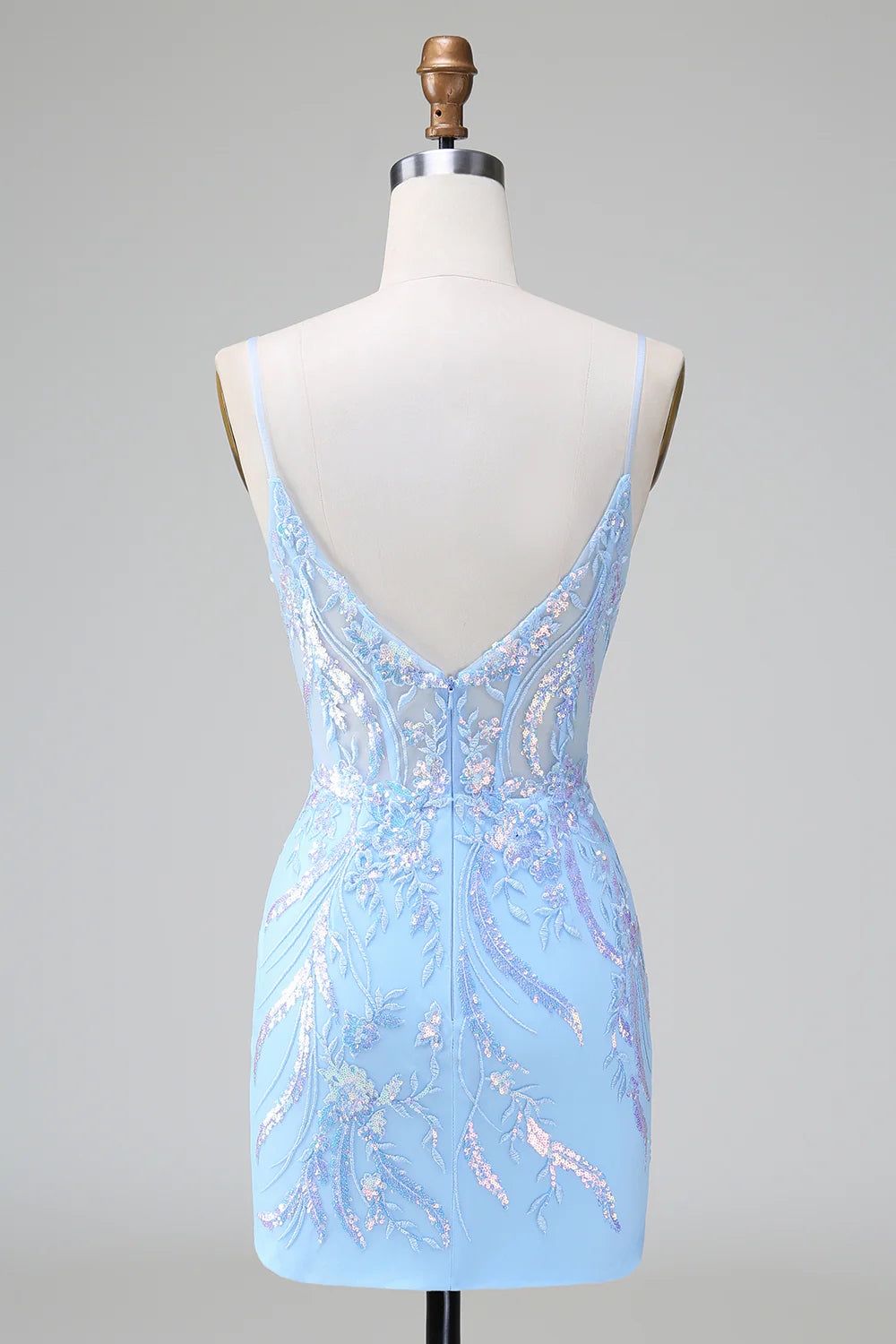 Back view of a woman wearing a sequined short formal dress.