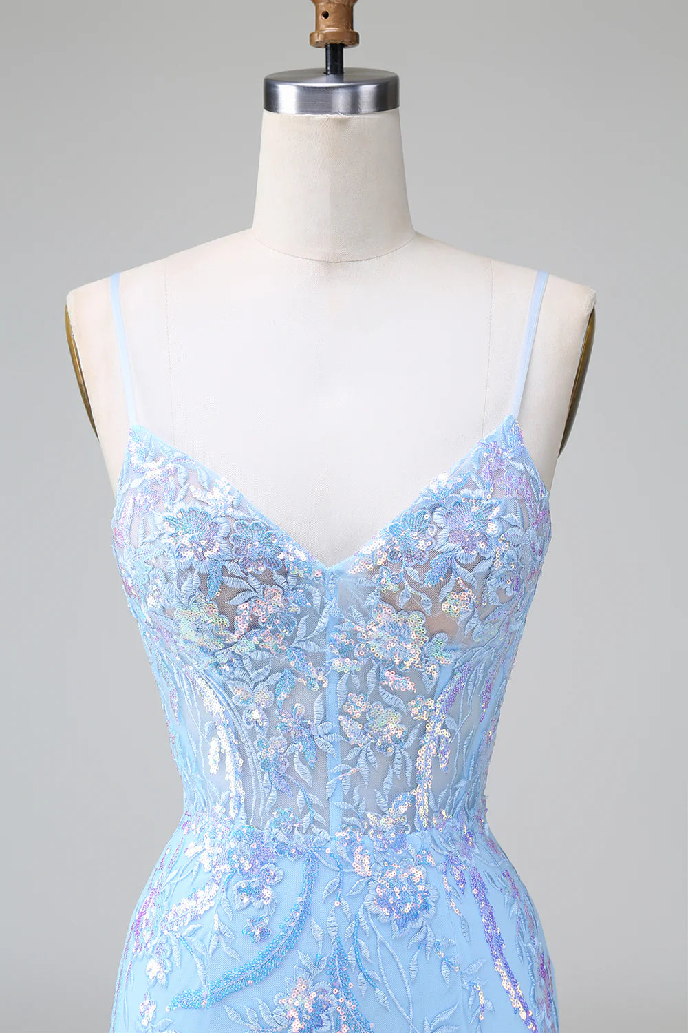Side profile of a sequined short dress for homecoming.