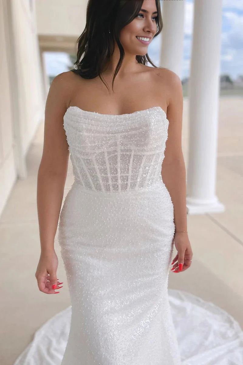 Back view of a glamorous mermaid wedding gown with sequins.