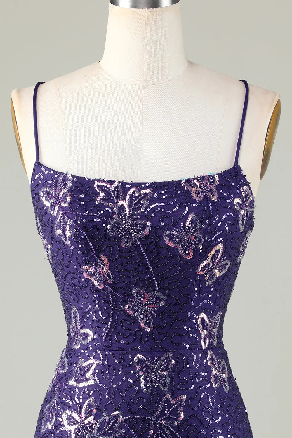 Close-up of the shimmering sequin fabric on the silver homecoming dress.