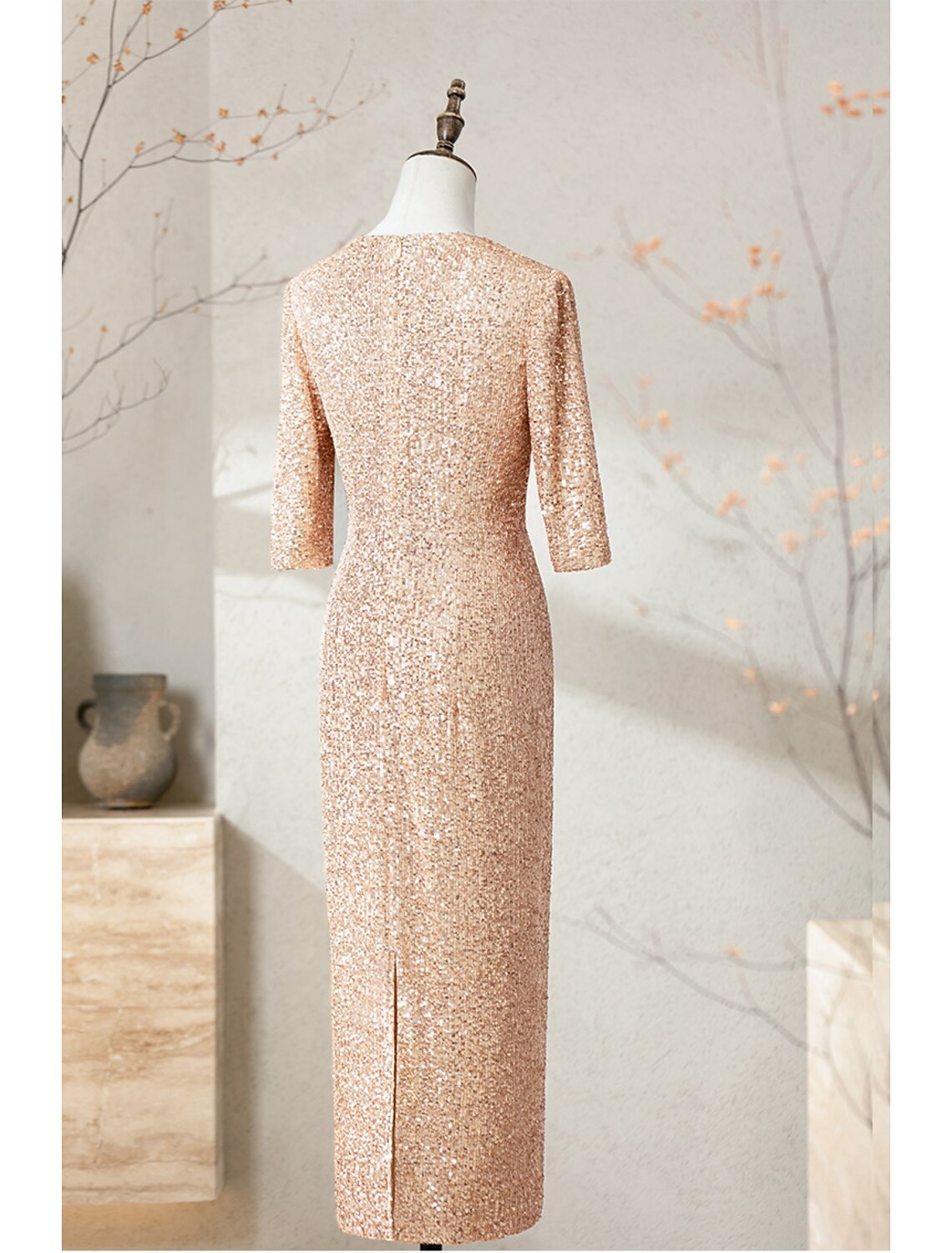 Close-up of the sequin detail on the navy blue half sleeve cocktail dress.