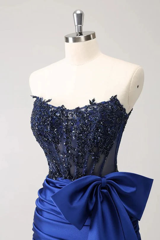 Back view of a woman in a sparkly strapless tight short homecoming dress.