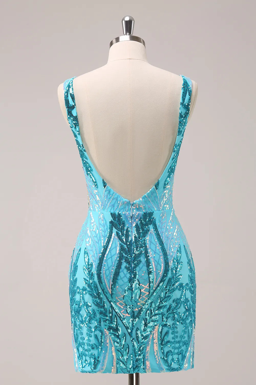 Close-up of the sequin detail on a blue sparkly V-neck dress.