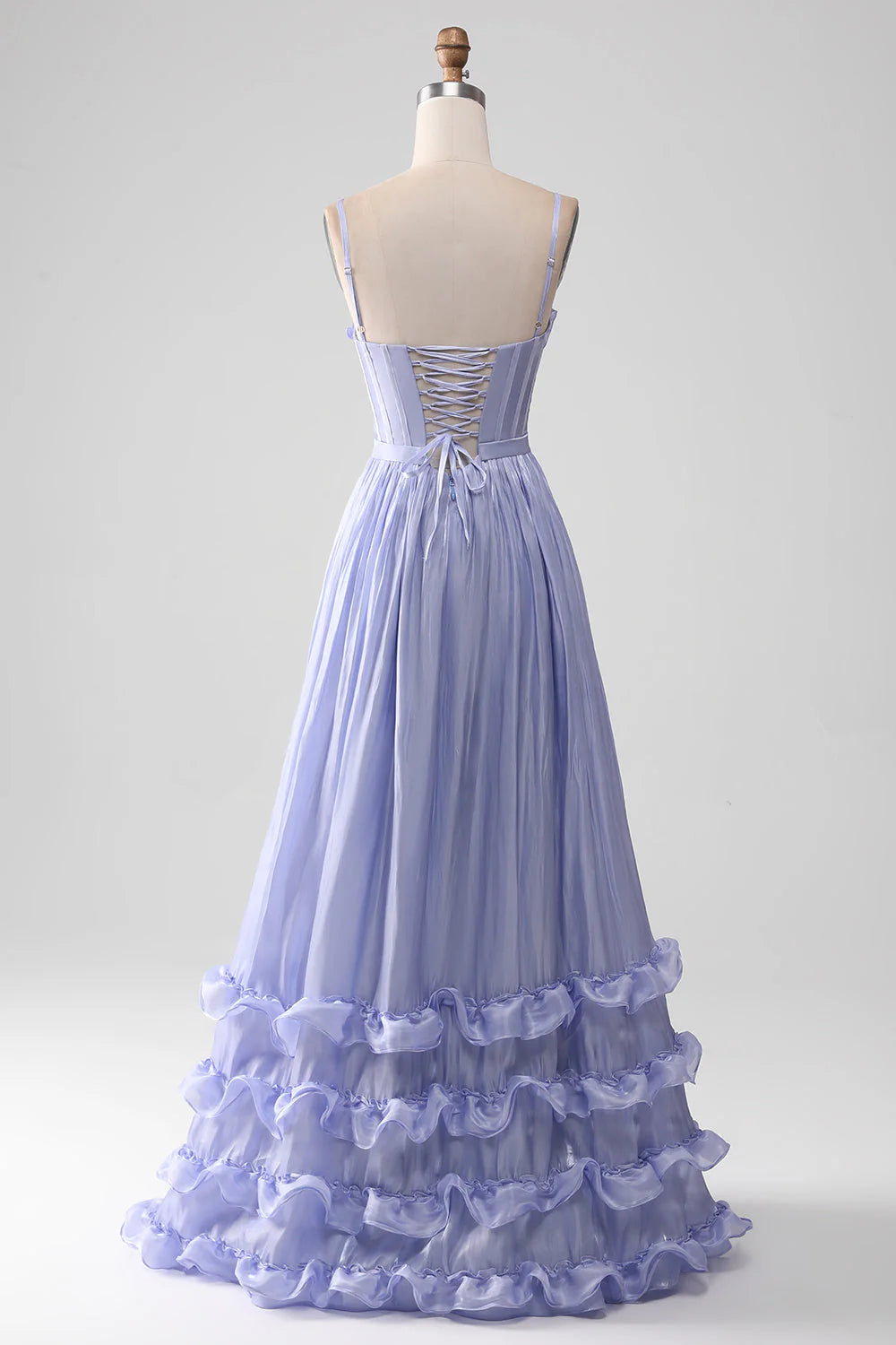 Back view of a lavender A-line prom dress with a high slit.