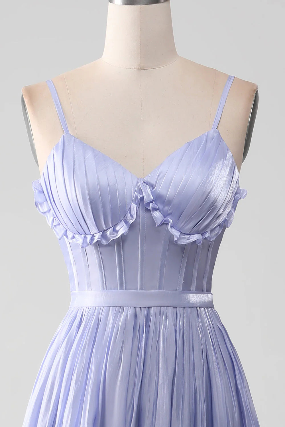Full length view of a lavender A-line prom dress with a flowing skirt and slit.
