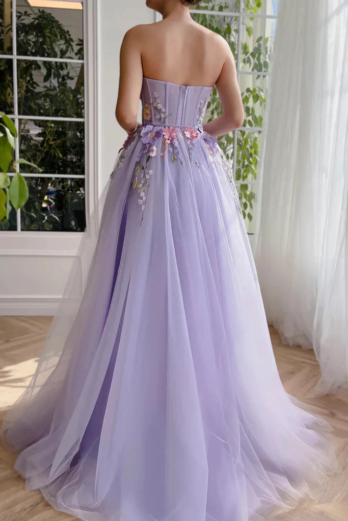 A-Line strapless formal dress with intricate 3D floral details, side view.