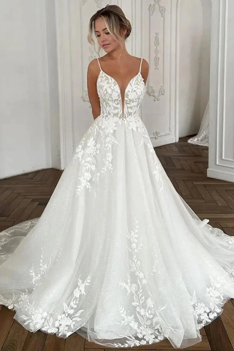 Elegant A-line V-neck wedding dress with appliques and tulle fabric.