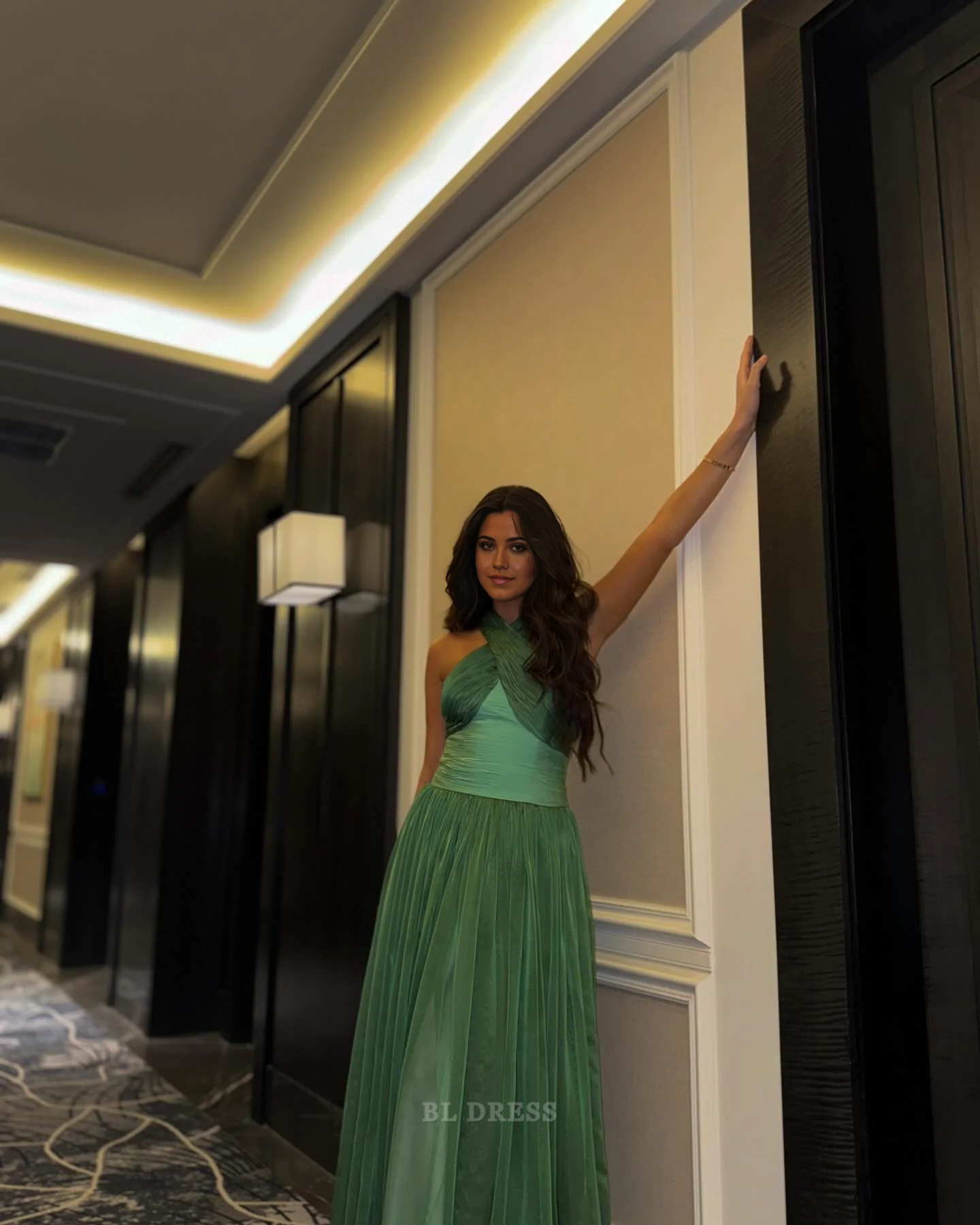 Elegant green A-line V-neck sleeveless formal dress.