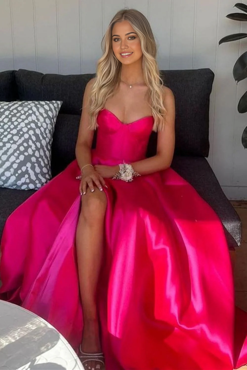 Green A-line prom dress with flowing skirt and front split.