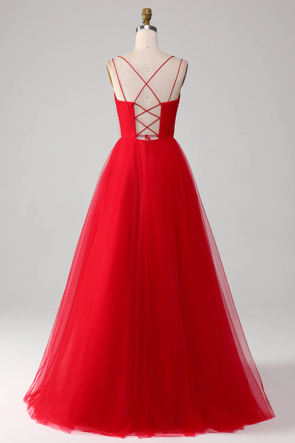 Back view of the red A-line prom dress showcasing the intricate criss-cross straps.