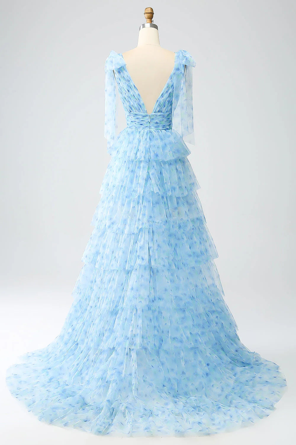 Light blue A-line V-neck tiered dress with flowing skirt detail.