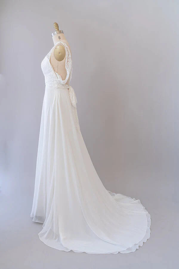 Full length view of the elegant V-neck wedding dress.