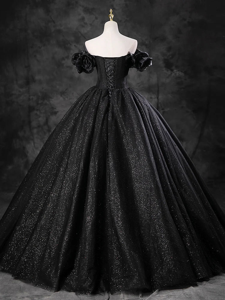 Side view of a model wearing the light blue off-shoulder tulle gown.