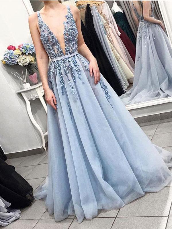 Elegant A-line V-neck prom dress with intricate beading.