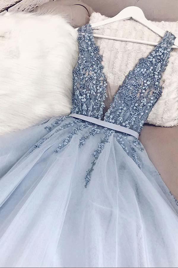 Close-up of the V-neckline and delicate beading on the prom dress.