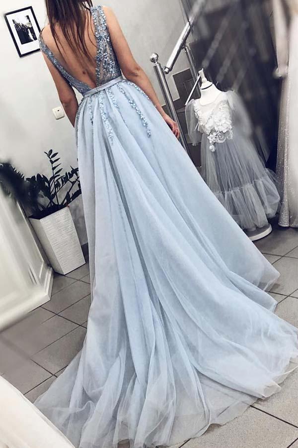 Back view of the flowing A-line powder pink maxi prom dress.