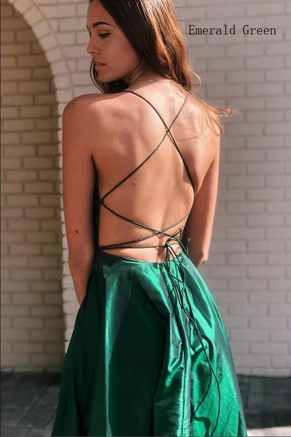 Back view of the royal blue A-line satin prom dress, showing criss-cross straps.