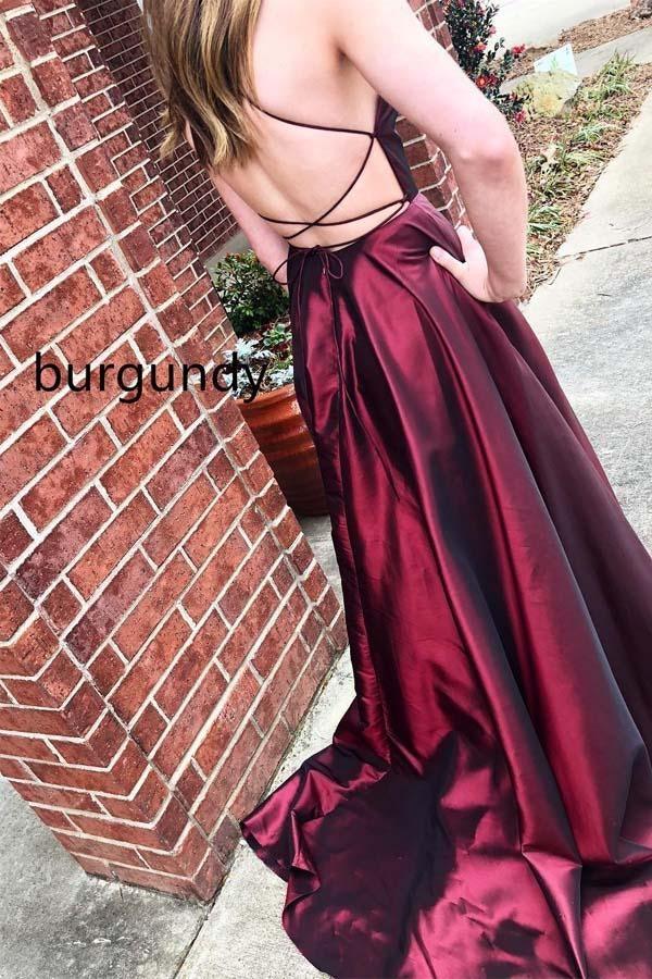 Full length view of the royal blue A-line satin prom dress with a model posing.