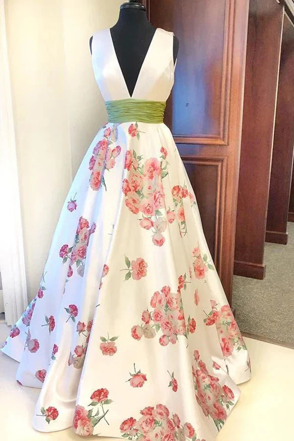 A-line V-neck prom dress with floral print and delicate straps.