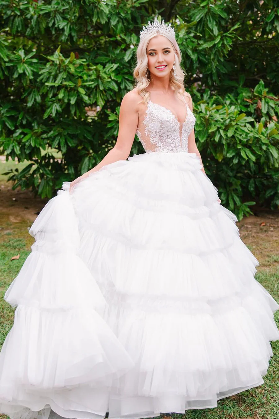 White A-line V-neck tulle ball gown with appliques.