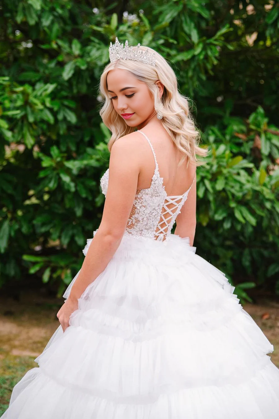 Elegant white long formal dress with V-neck and tulle skirt.