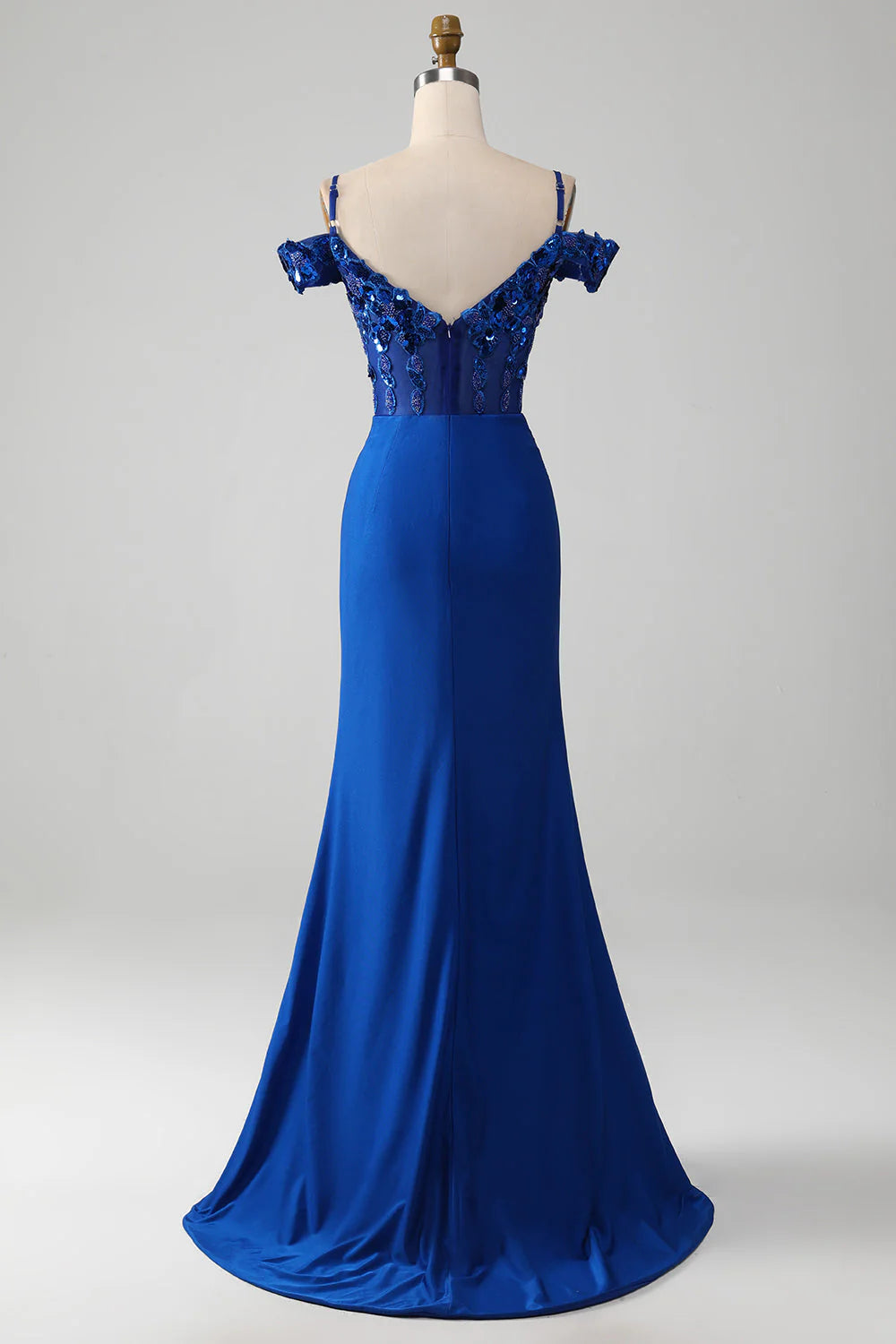 Close-up of the intricate beading and corset detail on the royal blue prom dress.