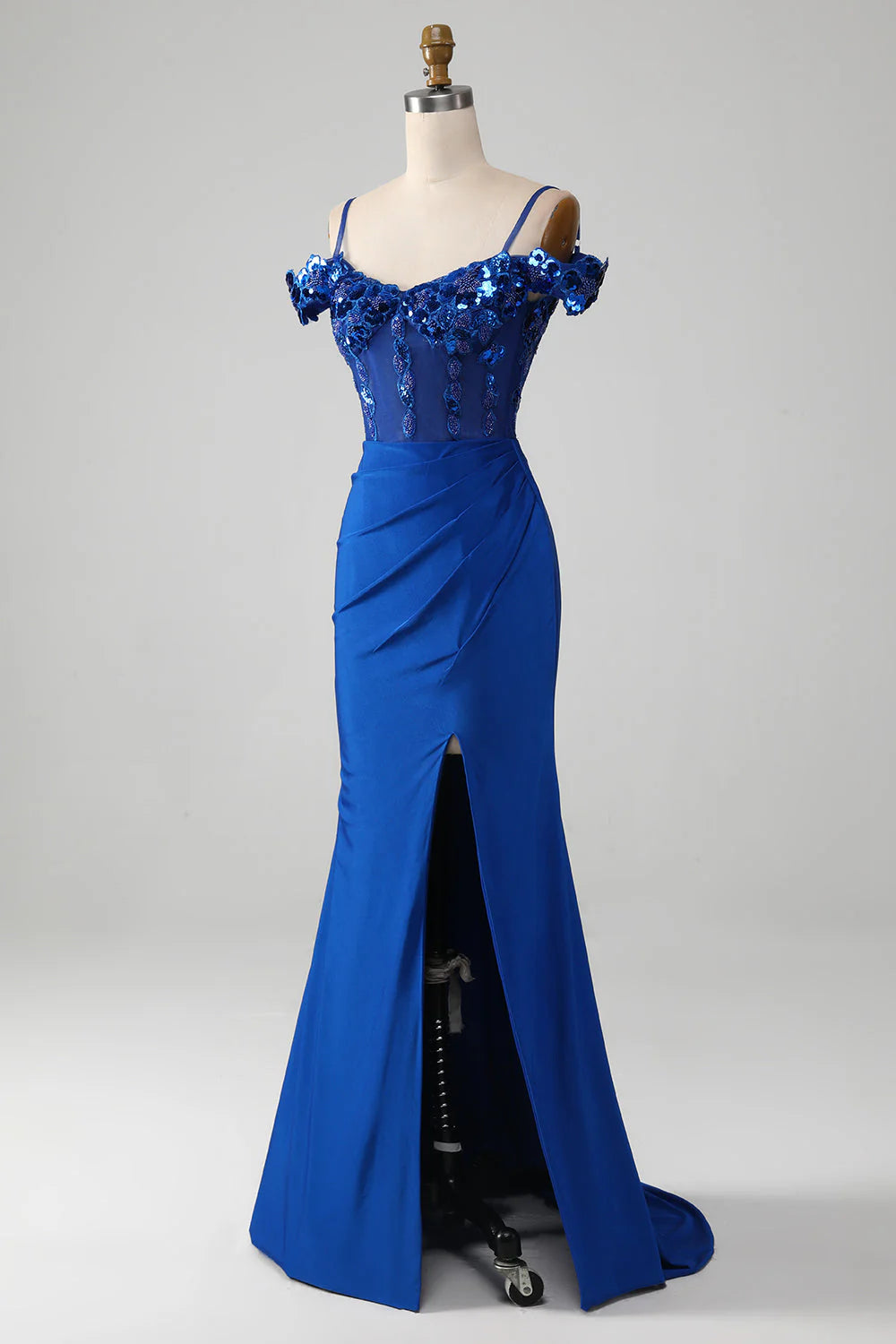 Full view of the royal blue prom dress, highlighting the flowing skirt and thigh-high slit.