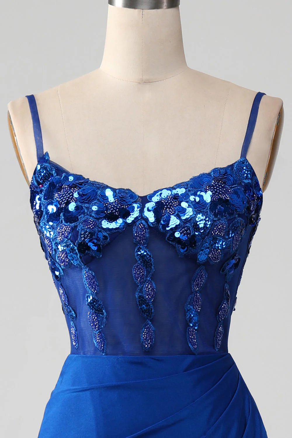Side view of the royal blue beaded corset prom dress, showcasing the elegant silhouette.