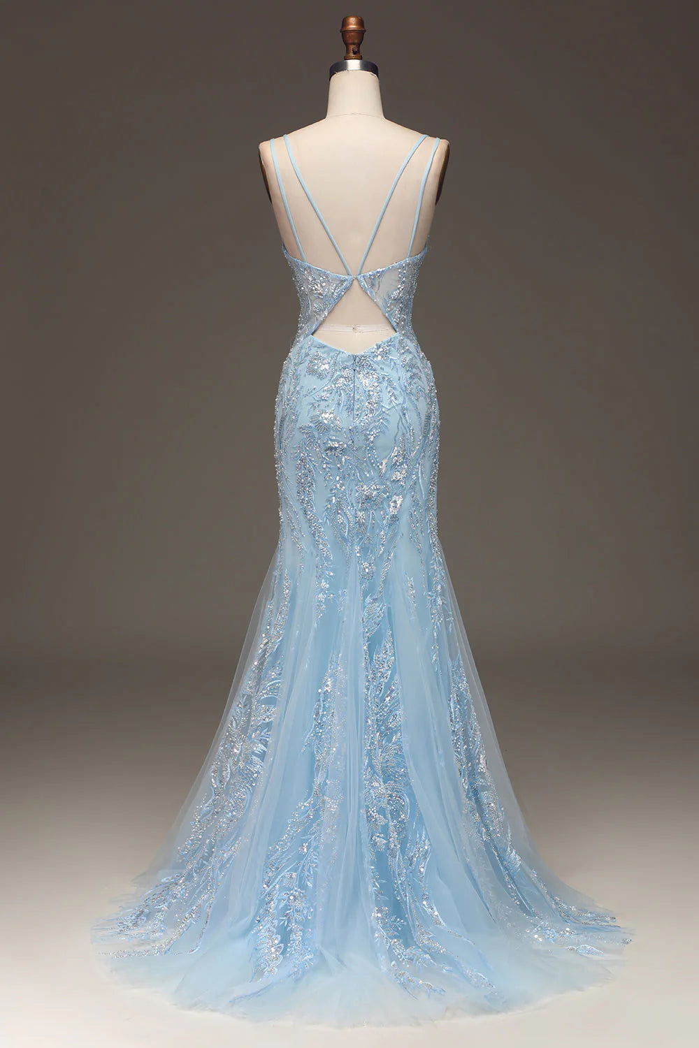 Side view of a light blue beaded mermaid gown.