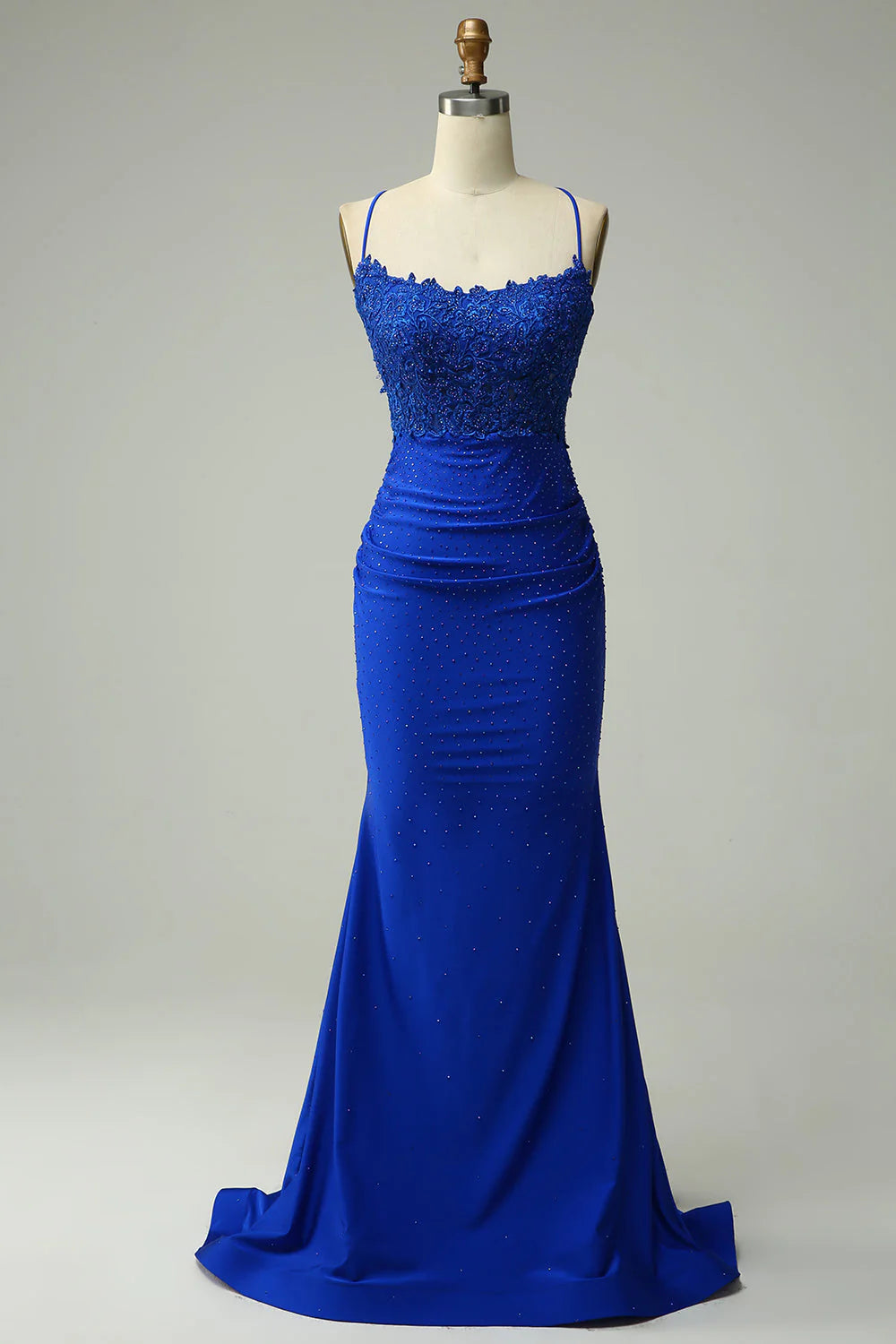 Royal blue mermaid prom dress with intricate beading on the sweetheart bodice.