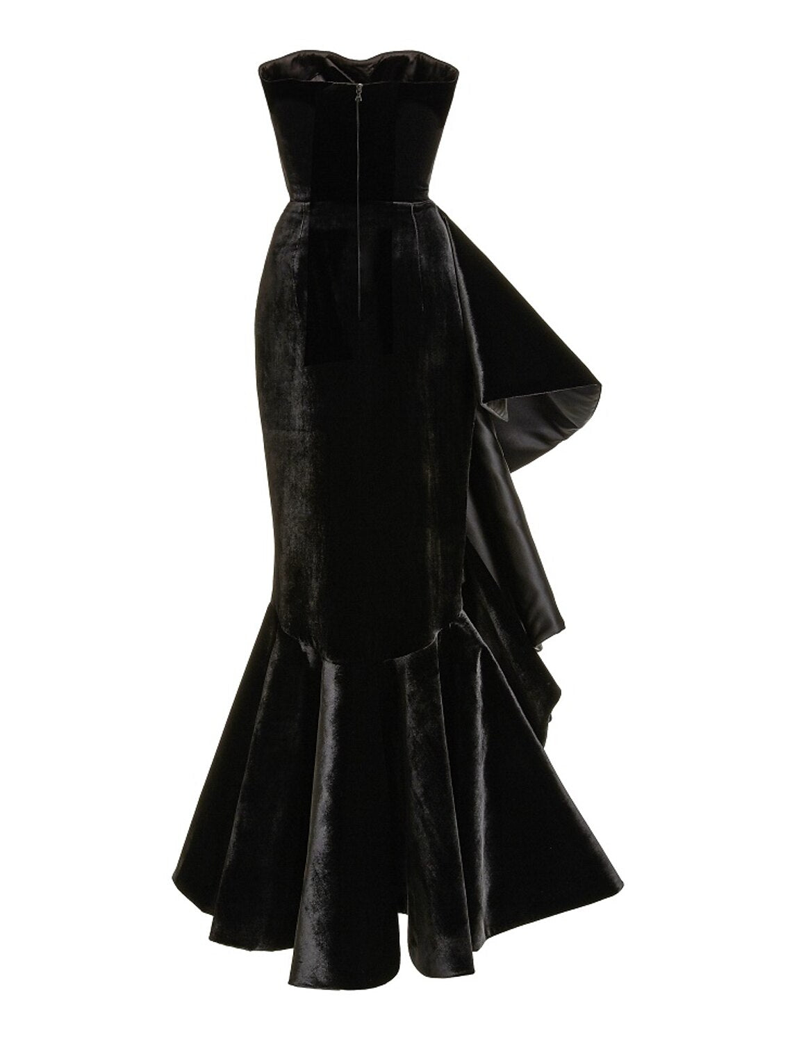 Model wearing a black velvet trumpet prom dress, side view.