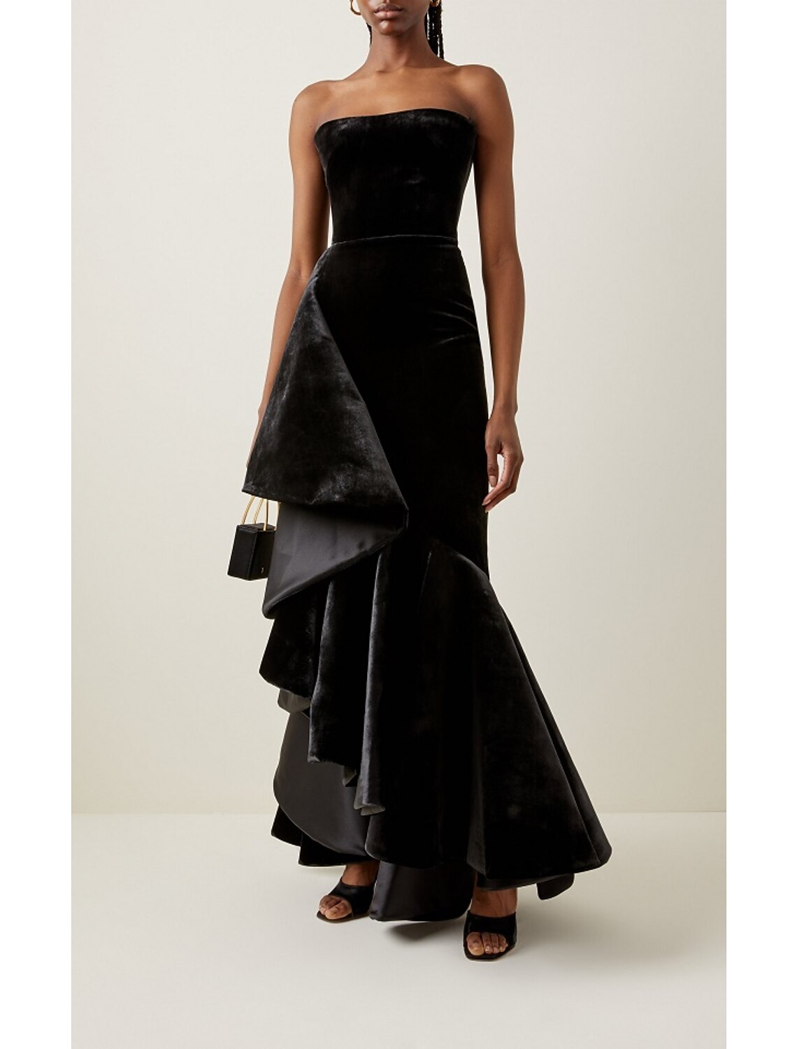 Back view of a strapless black velvet mermaid dress.