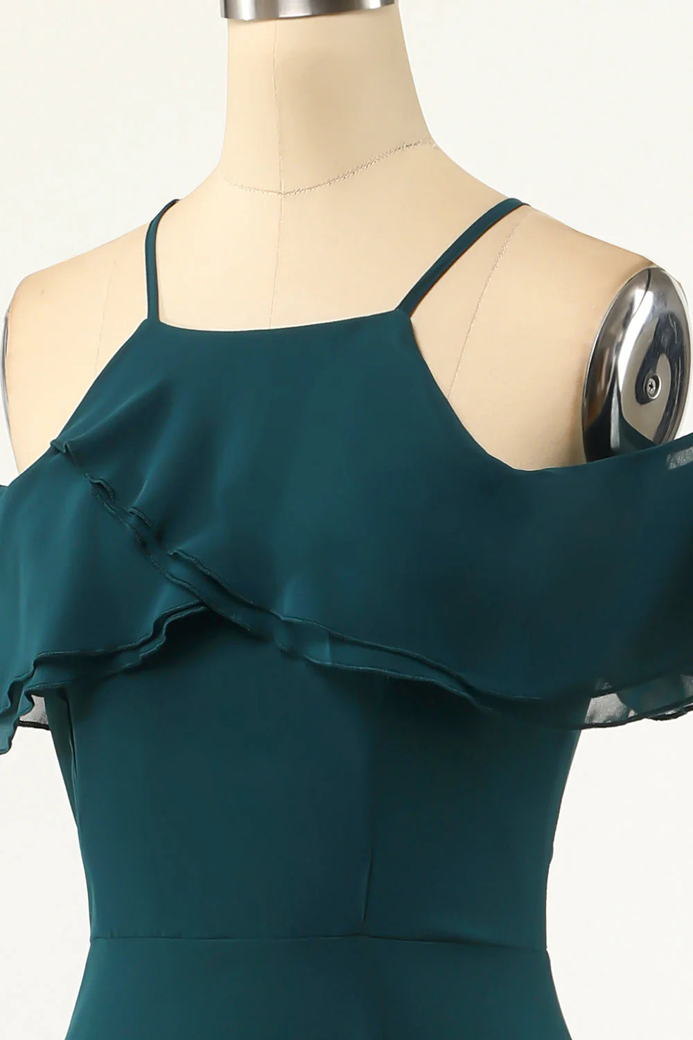 Close-up detail of the green cold shoulder A-line maxi dress.