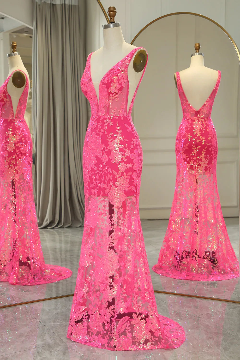 Fuchsia mermaid V-neck long prom dress with sequined appliques, elegant back view.