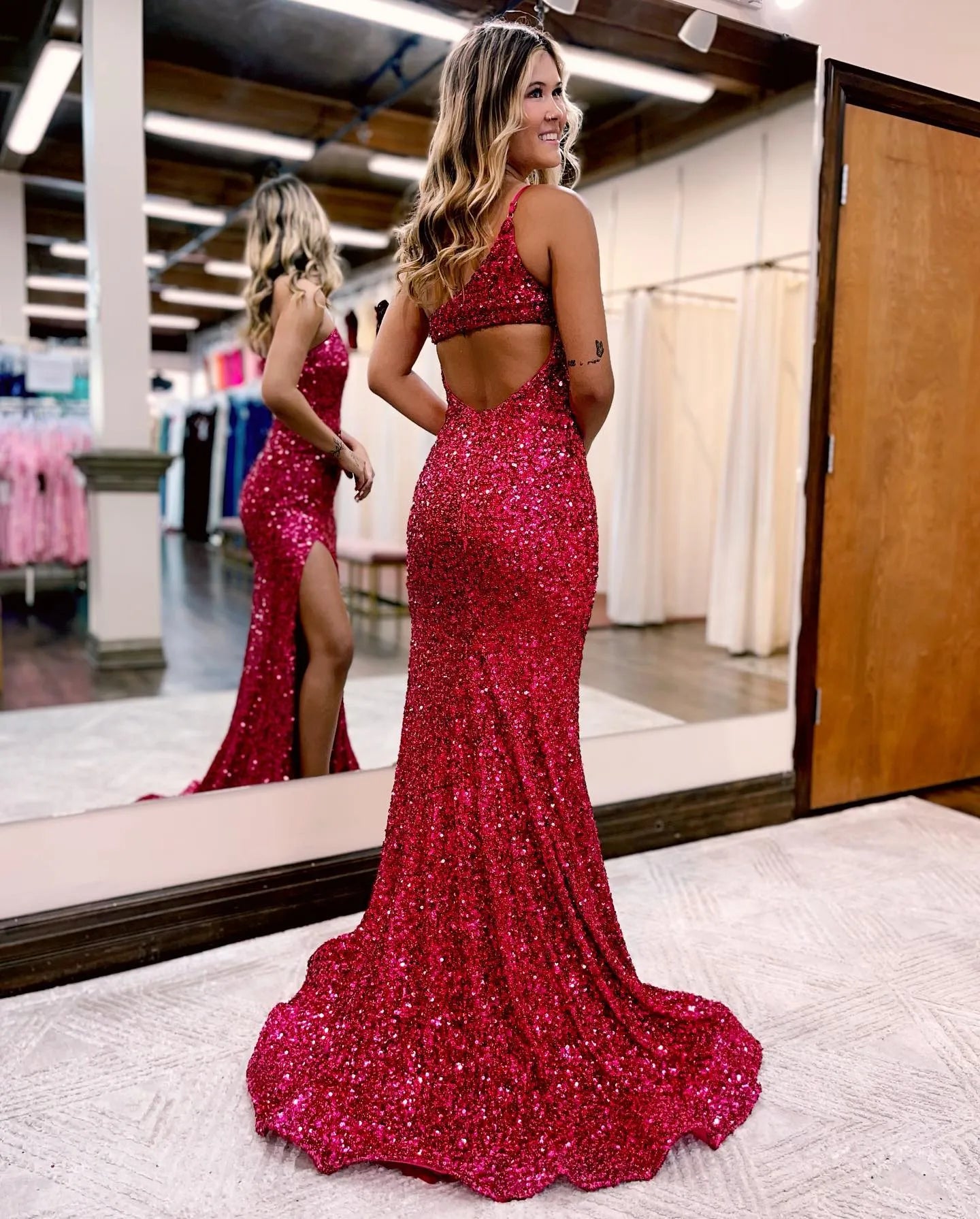 Full length view of the red glitter mermaid one-shoulder prom dress.