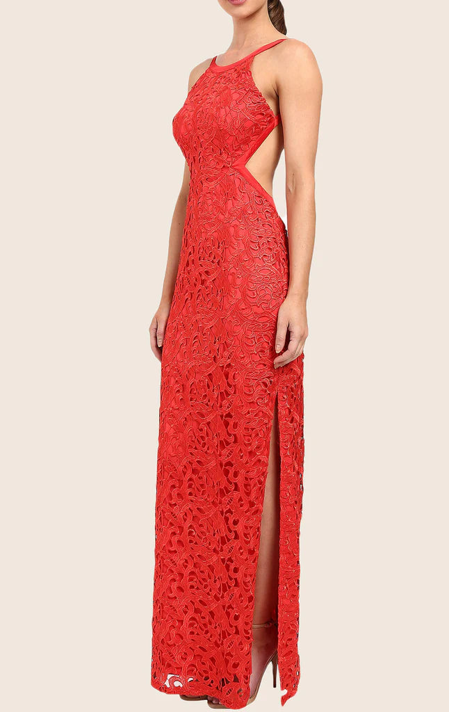 Side profile of a woman showcasing a halter neck lace maxi dress.