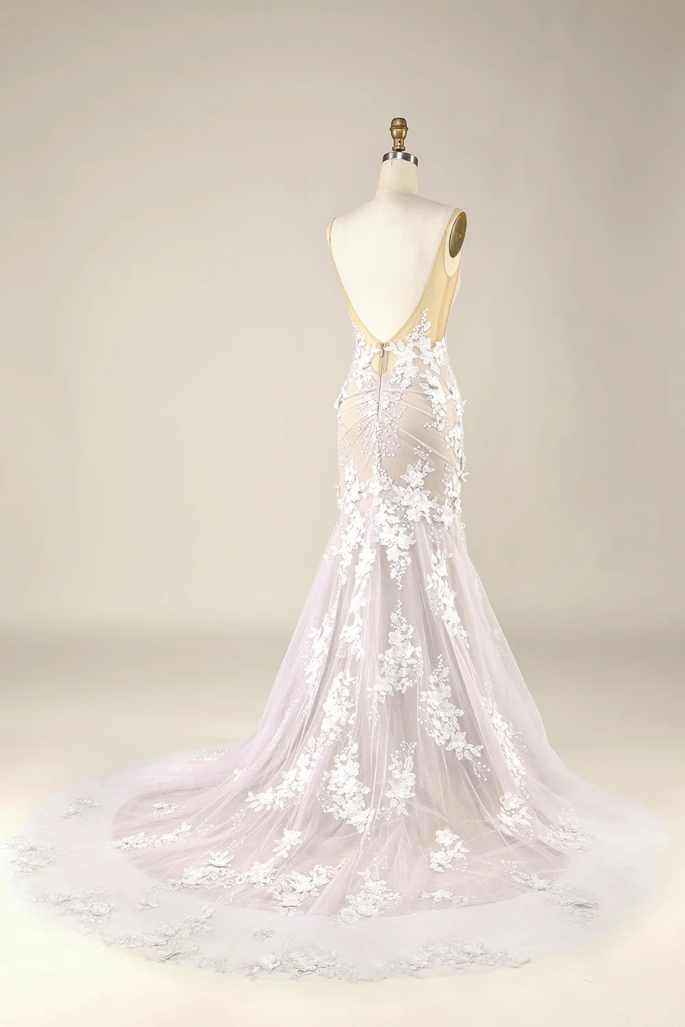 Close-up of appliques on ivory tulle wedding dress.