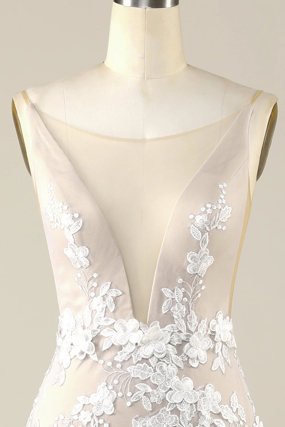 Back view of ivory tulle wedding dress showing backless design.