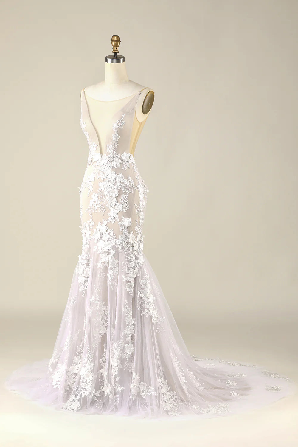 Side view of ivory tulle wedding dress with flowing skirt.