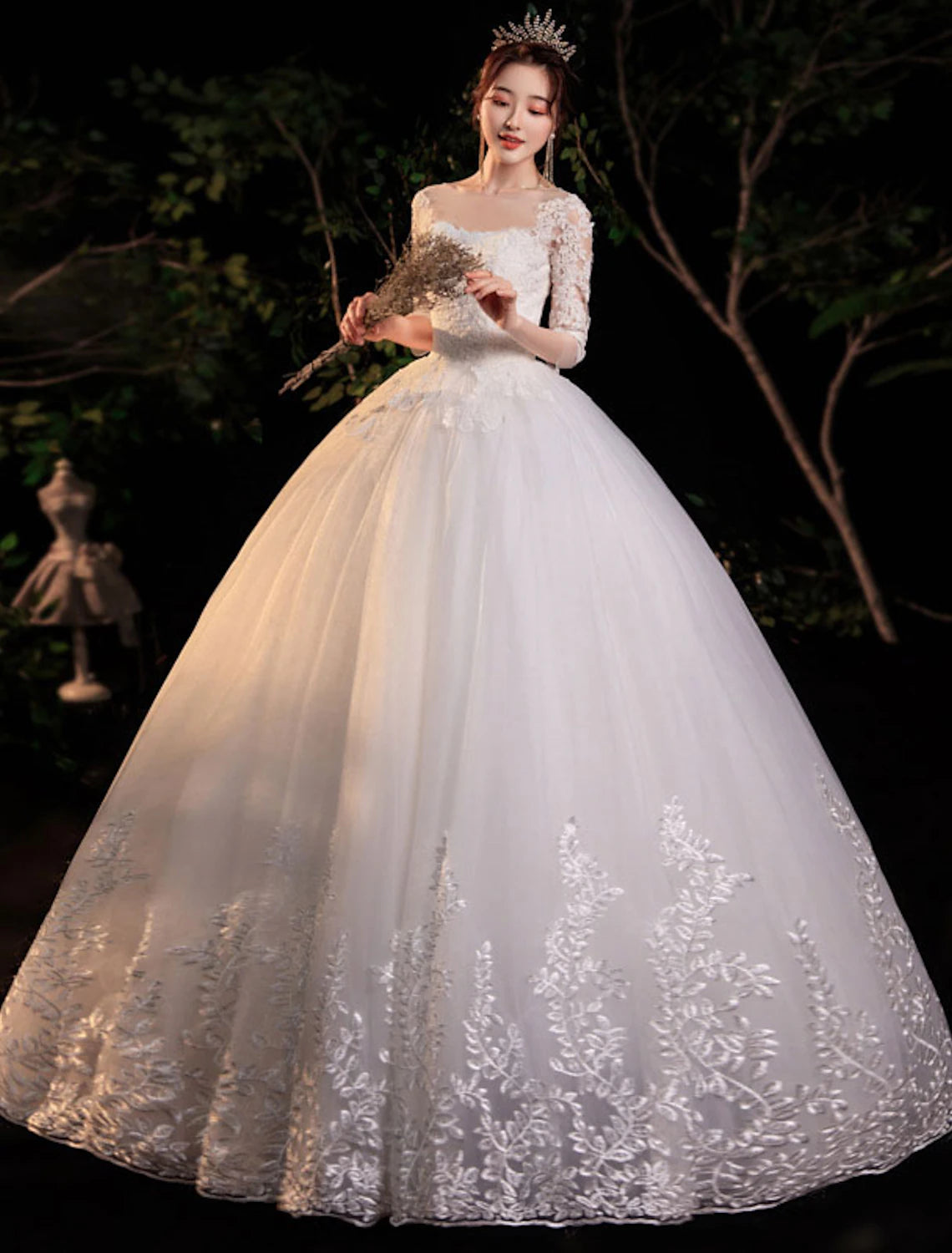 Back view of an elegant ball gown wedding dress with delicate lace details.