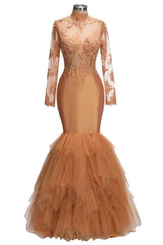Woman wearing a stunning mermaid high neck prom dress with intricate appliques.