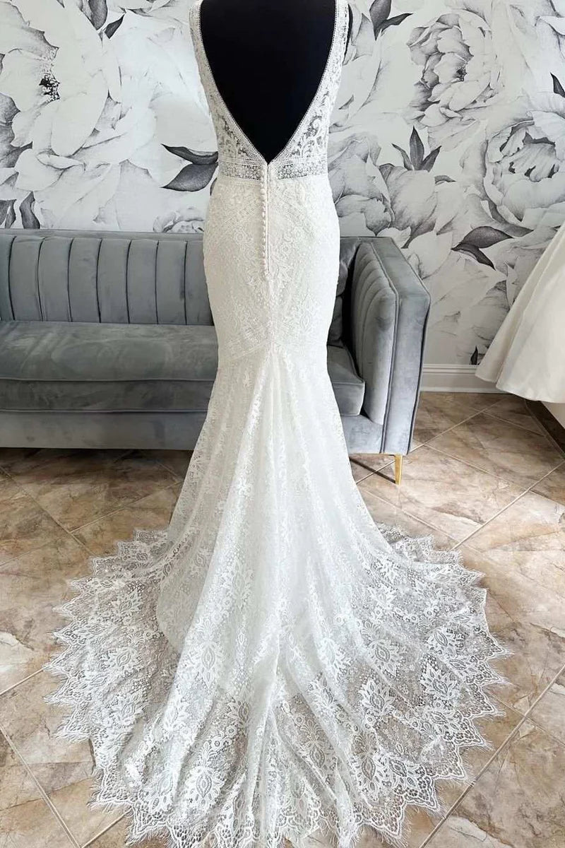Back view of the mermaid wedding dress, highlighting the open back and train.