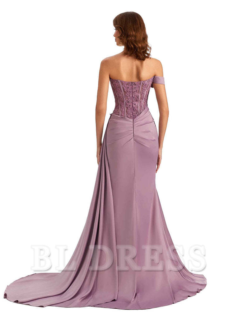 Back view of a woman in a mermaid off-shoulder formal dress with applique details.