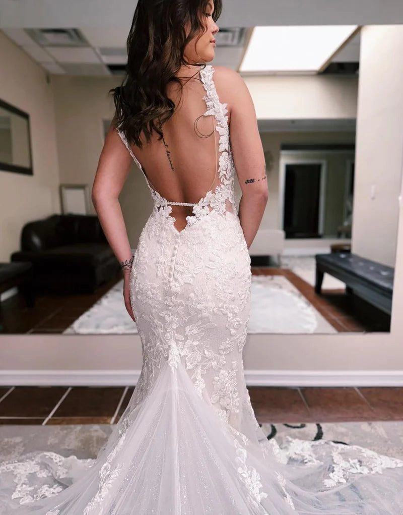 Full length view of mermaid wedding dress with chapel train.