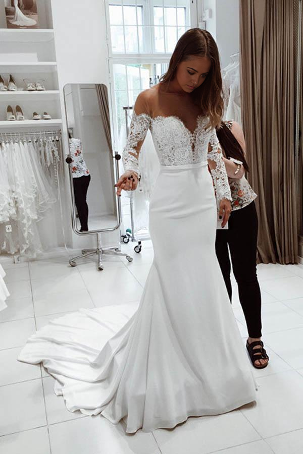 White mermaid wedding dress with scoop neckline.