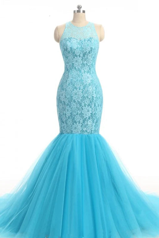 Woman wearing an elegant mermaid prom dress with a shawl neckline.