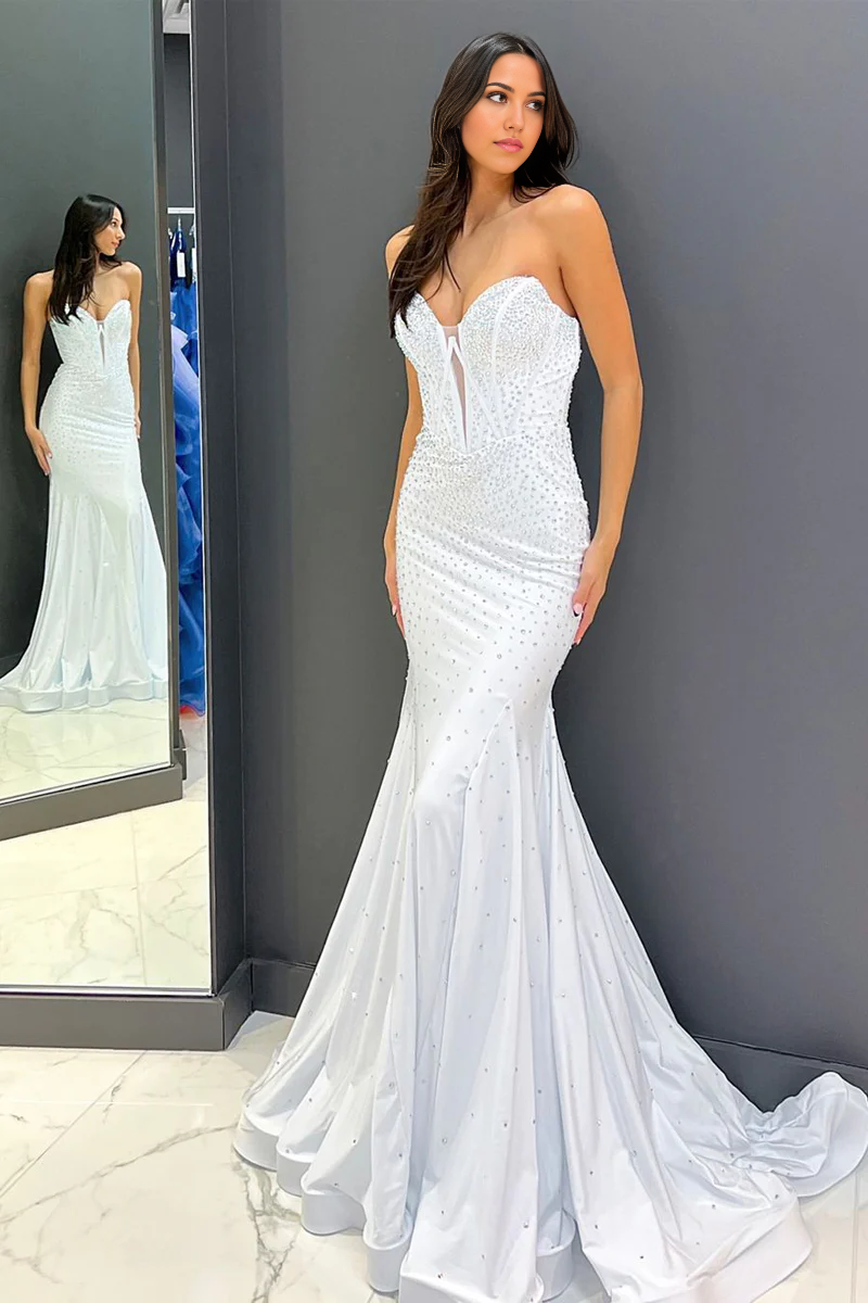 White mermaid prom dress with sweetheart neckline and intricate beading.