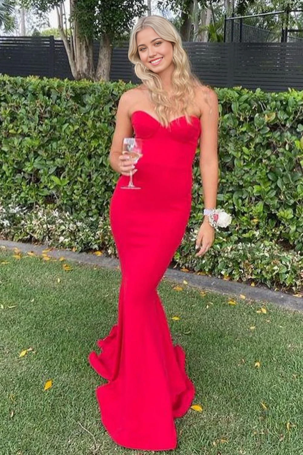Front view of a stunning red mermaid formal prom dress with a sweetheart neckline.