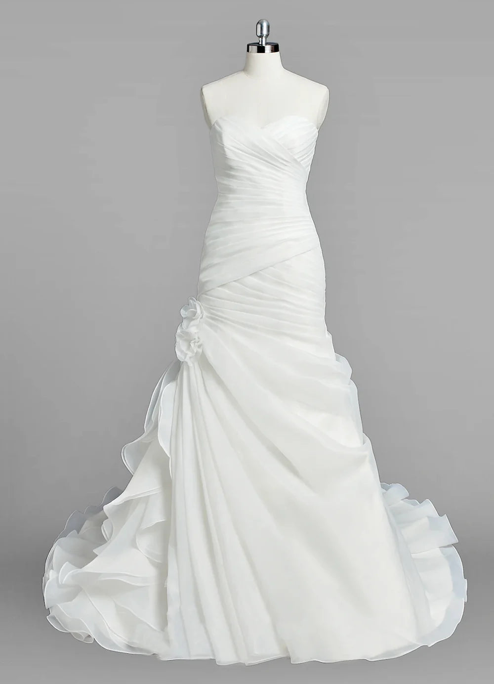Elegant mermaid wedding dress with ruched bodice and cascading ruffles.