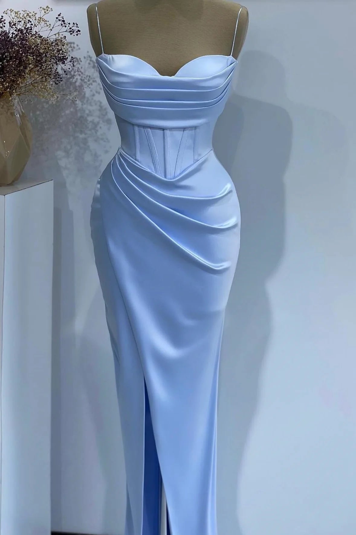 Elegant mermaid prom dress with sweetheart neckline and spaghetti straps.